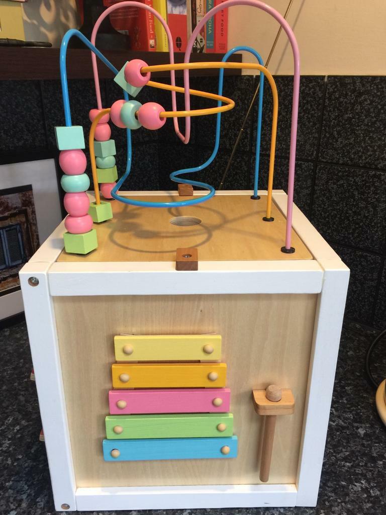 pink wooden activity cube